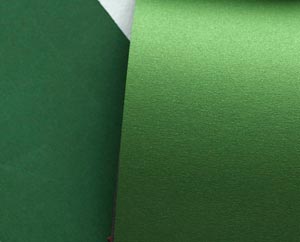 Green paper and envelopes Green paper and envelopes